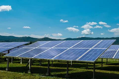 Solar module panels against blue sky background. Environmental energy resourc Stock Photos