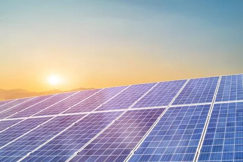 Solar panel against sunset background. Photovoltaic, alternative electricity Stock Photos