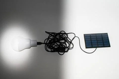 Solar panel and light bulb Stock Photos