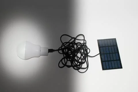 Solar panel and light bulb Stock Photos