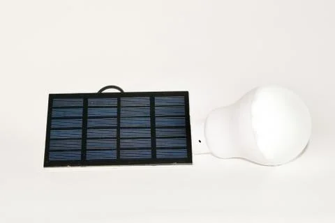 Solar panel and light bulb Stock Photos