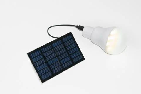 Solar panel and light bulb Stock Photos