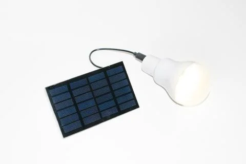 Solar panel and light bulb Stock Photos