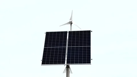 Solar panel and small wind turbine powering street light on pole Stock Footage 220126630