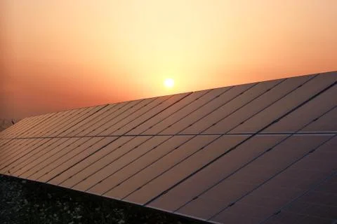 Solar panel and sunset. Stock Photos