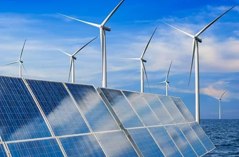 Solar panel and wind turbine farm clean energy. Stock Photos