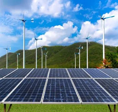Solar panel and wind turbines Stock Photos