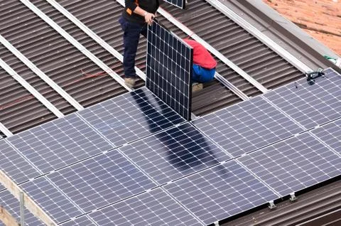 Solar panel and workers. Stock Photos