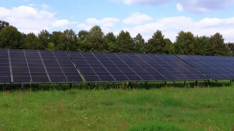 Solar Panel Array in a Green Field Stock Footage 289144627