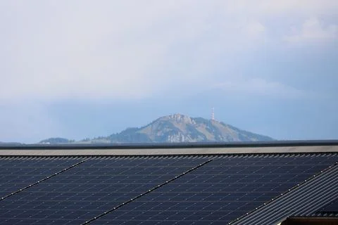 Solar panel array is installed on the roof of a building Stock Photos