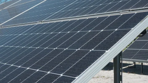 Solar panel array at photovoltaic power station for renewable energy Stock Footage 334390244