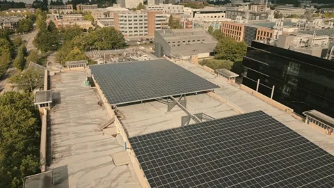 Solar panel array powering green hydrogen facility captured by high angle drone Stock-Footage 334012562