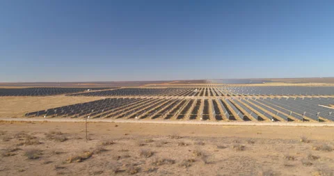 Solar Panel array solar farm texas fly drone over side Video stock 329952826