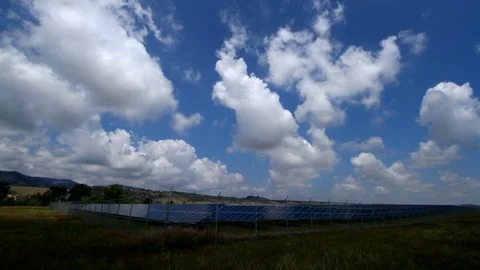 Solar Panel Array time-lapse with rolling clouds against the blue sky Stock Footage 81150162