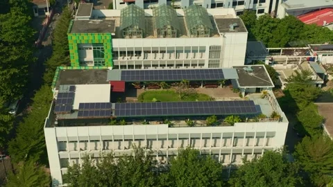 Solar panel arrays installed across rooftop of Yogyakarta building Stock-Footage 342581158