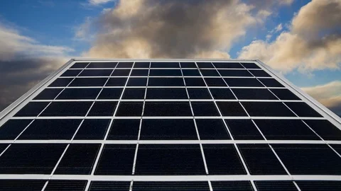 Solar panel on a background of a beautiful blue sky. Green energy. Timelapse. Stock Footage 113964472