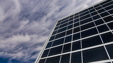Solar panel on a background of a beautiful blue sky. Green energy. Timelapse. Stock Footage 113964513