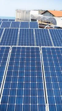 Solar Panel Cells Installed on Rooftop for Clean Electricity Stock Photos