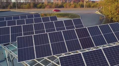 Solar panel charging station for electric vehicles near the highway, no people 스톡 동영상 153015922