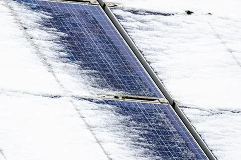 A solar panel covered in snow Stock Photos
