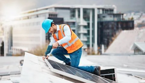 Solar panel, drill and engineering with man on roof top for renewable energy Stock Photos