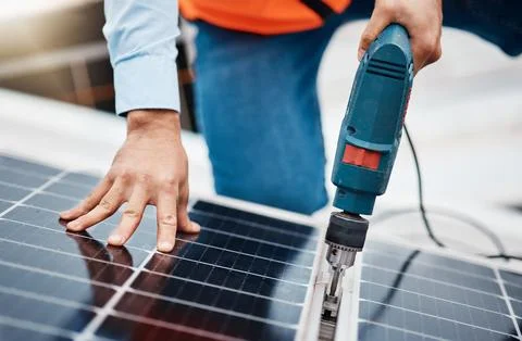 Solar panel, drill and engineering with hands of man for renewable energy Stock Photos