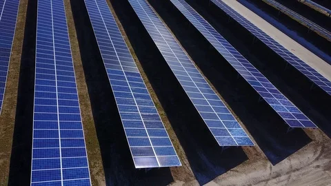 Solar Panel Farm aerial sun reflection off panels Stock Footage 101251691