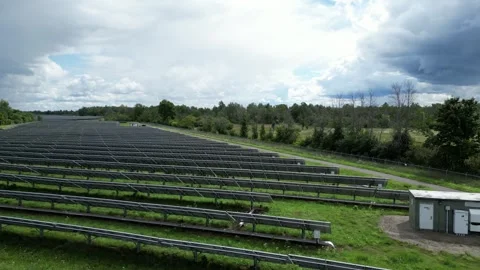 Solar Panel Farm Grid Electric Power Green Energy Plant with Drone Stock Footage 295508555