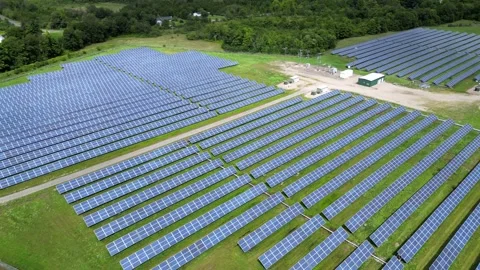 Solar Panel Farm Grid Electric Power Green Energy Plant with Drone Stock Footage 295509419