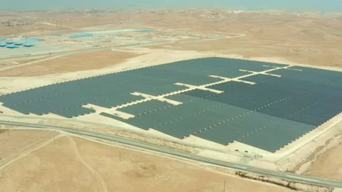 Solar panel farm to harvest renewable energy in rural desert in Jordan Stock Footage 297239102