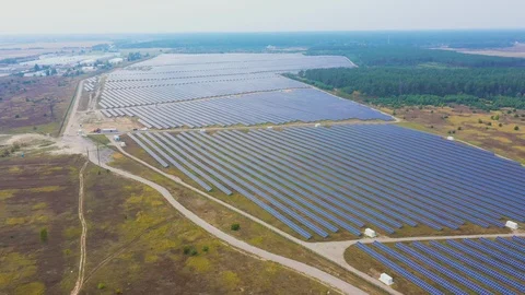Solar panel farm seen from above, filmed by drone Видео 116779129