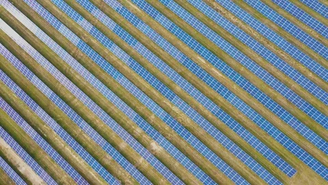 Solar panel farm seen from above, filmed by drone Видео 116779239