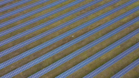 Solar panel farm seen from above, filmed by drone Stockbeeldmateriaal 116779826