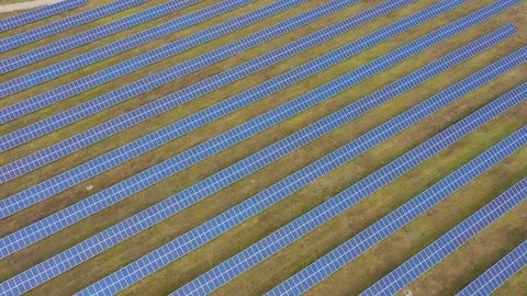 Solar panel farm seen from above, filmed by drone Stockbeeldmateriaal 116780060