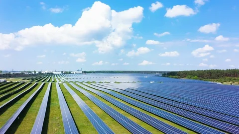 Solar panel farm seen from above, filmed by drone Видео 129687504