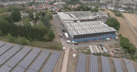 Solar Panel Field Beside Industrial Hall, Photovoltaic Energy, Aerial Drone Shot Stock Footage 340304742