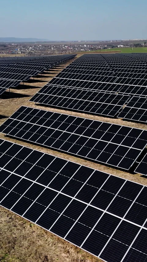 Solar panel field with rows of photovoltaic modules capturing sunlight Stock Footage 340275129