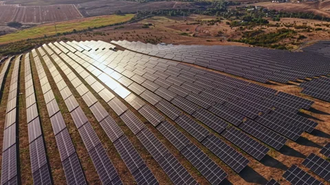 Solar panel field in a rural area during a sunny day with rows of solar panels Stock Footage 344777963