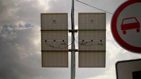 Solar panel installation on a city pole to power speed cameras and surveillance Stock Footage 240579899