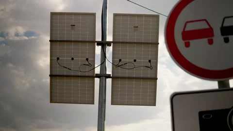 Solar panel installation on a city pole to power speed cameras and surveillance Stock Footage 240580369