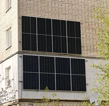 Solar panel installation covers building facade with renewable energy technology Stock-Fotos