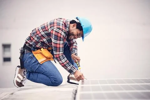 Solar panel installation, engineer and black man on roof, sustainable or Stock Photos