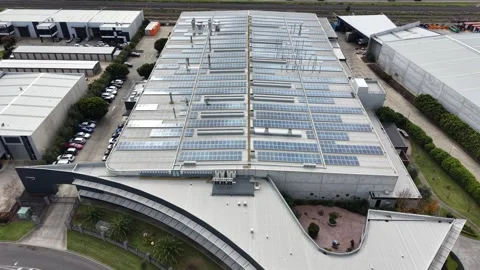 Solar panel installation on a modern industrial building roof Stock Footage 340503342