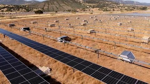 Solar panel installation process in large pastures for sustainable energy g.. Stock Photos