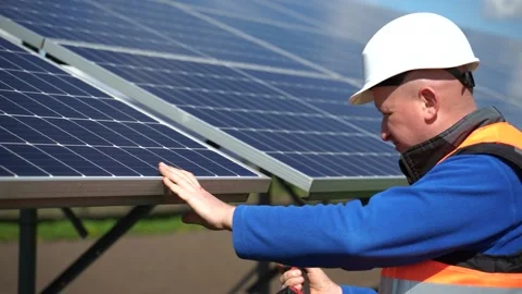 Solar Panel Installation Process. Technician Worker With Electric Wrench Stock Footage 168178488