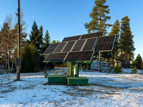 Solar Panel Installation in a Winter Forest Stock Photos