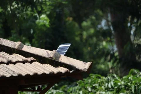 Solar panel installed on rooftop with nature background Stock Photos