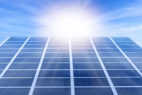 Solar panel lit by the sun rays Stock Photos