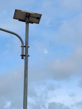 Solar Panel on a Metal Post Under Cloudy Sky Stock Photos