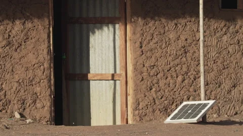 Solar panel outside african hut Stock Footage 249671349